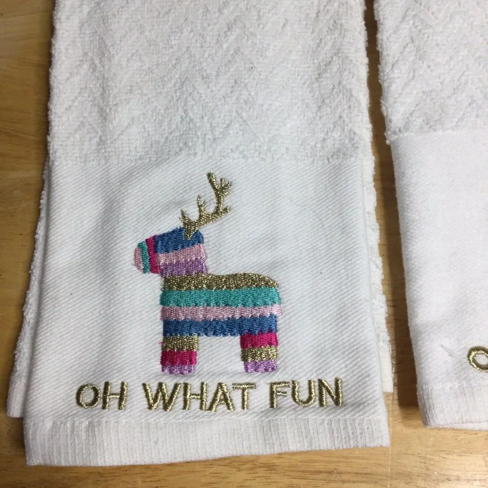 2 festive‎ holiday towel sparkly reindeer piñata and the words Oh What Fun